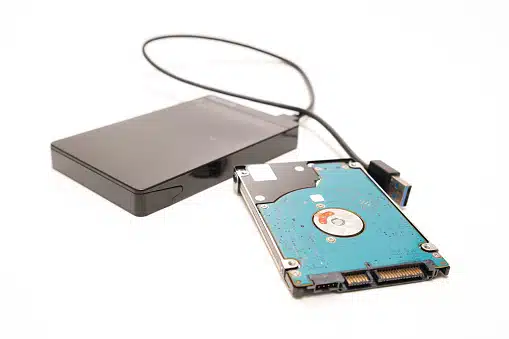 Technician recovering data from a failed 2.5-inch hard disk at Payam Data Recovery, Australia