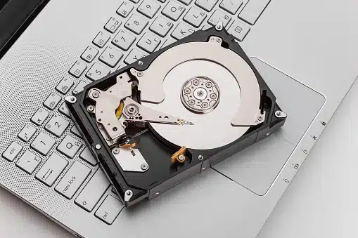 HDD on laptop keyboard at Payam Data Recovery, Australia’s data recovery experts.