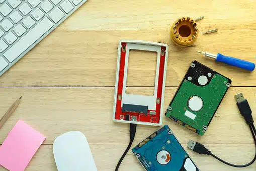 Portable external hard drive on wooden table – expert data recovery services by Payam Australia