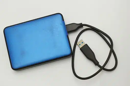 Blue external hard disk with USB cable for data recovery at Payam Data Recovery, Australia.