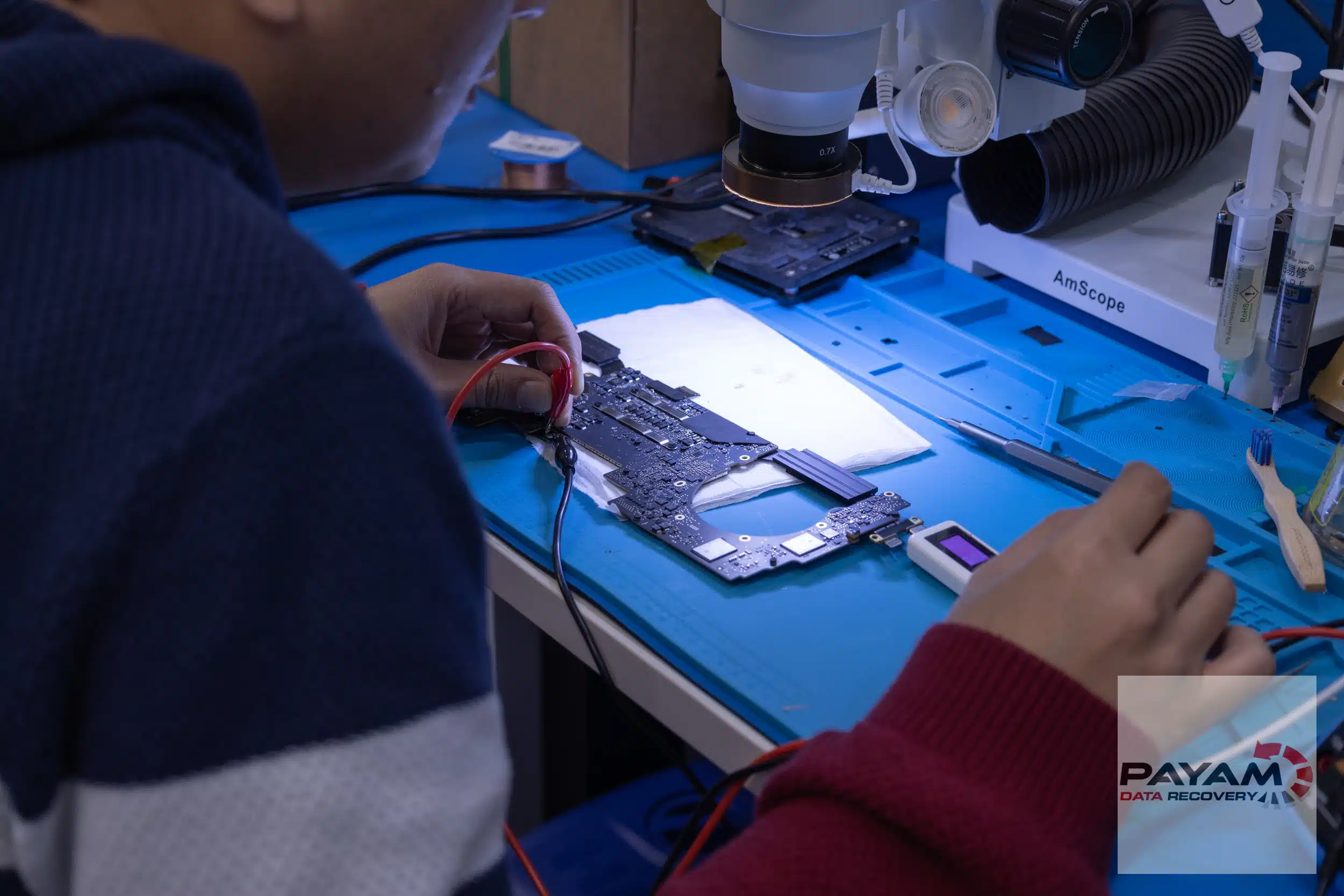 Payam Data Recovery technician repairing a logic board in Melbourne for specialised data recovery services