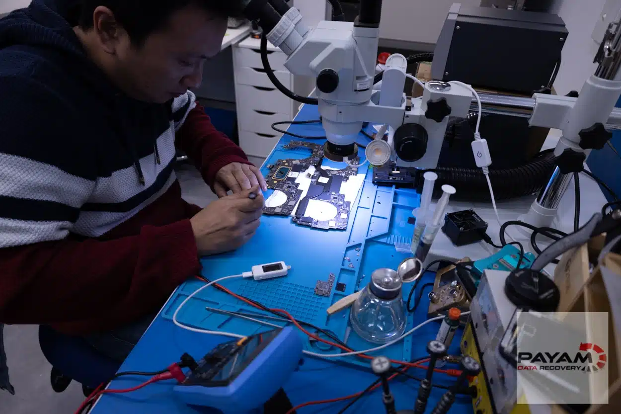 Payam Data Recovery technician repairing MacBook logic board in Brisbane for expert data recovery services