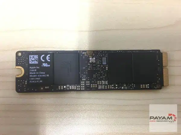 Apple 256GB blade SSD, model 656-0023B, showing memory chips and the gold edge connector