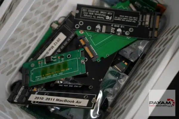 Bin of MacBook SSD adapter boards, one labelled 2010 2011 MacBook Air