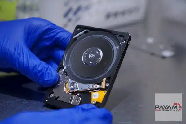 Scratched hard drive platter being assessed by Payam Data Recovery for expert data recovery in Brisbane.