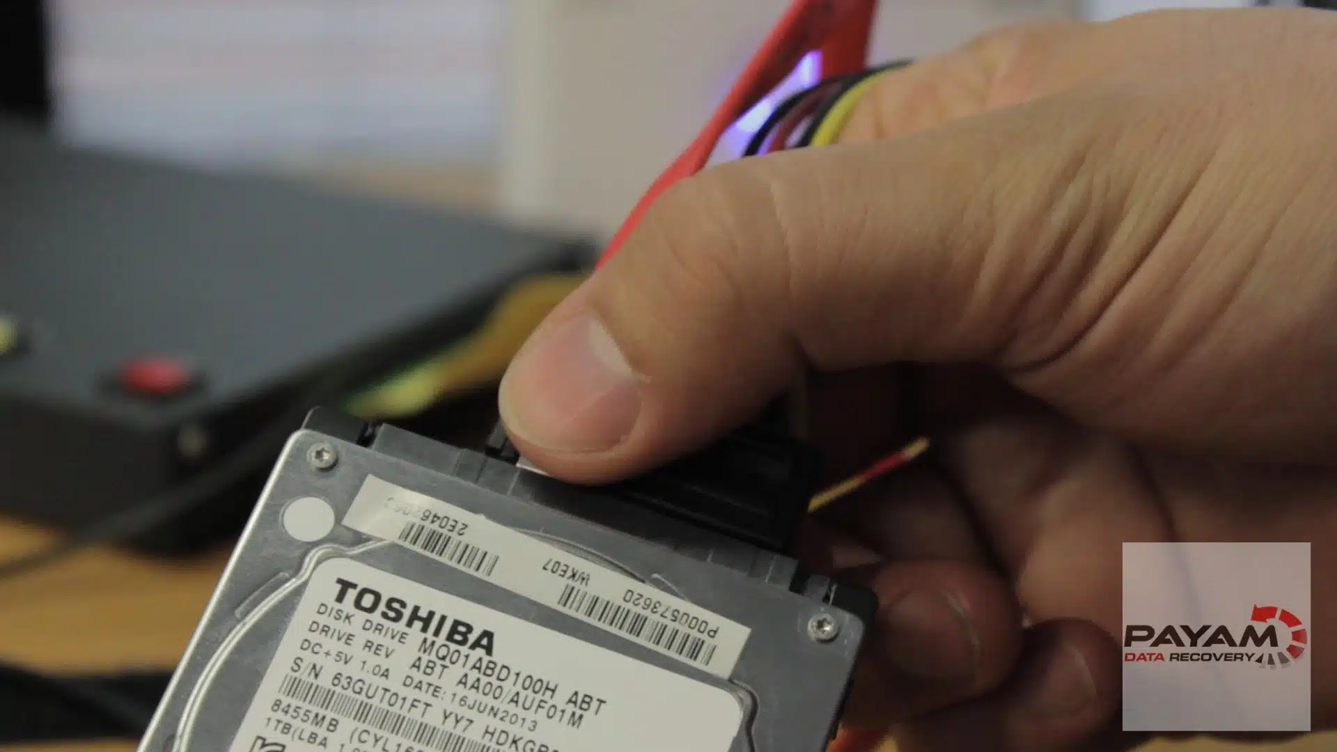 Payam Data Recovery technician working on Toshiba 2.5-inch hard drive data recovery in Melbourne