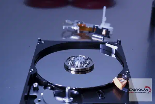 Opened Toshiba hard drive on clean bench at Payam Data Recovery, showing advanced hard drive data recovery tools in Melbourne lab for intricate data retrieval.