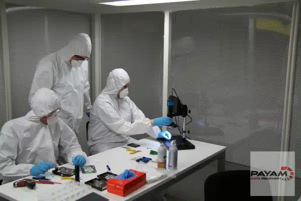 Payam Data Recovery technicians in Sydney cleanroom performing hard drive data recovery.
