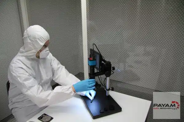 Technician in cleanroom at Payam Data Recovery, performing LaCie hard drive data recovery in Sydney.