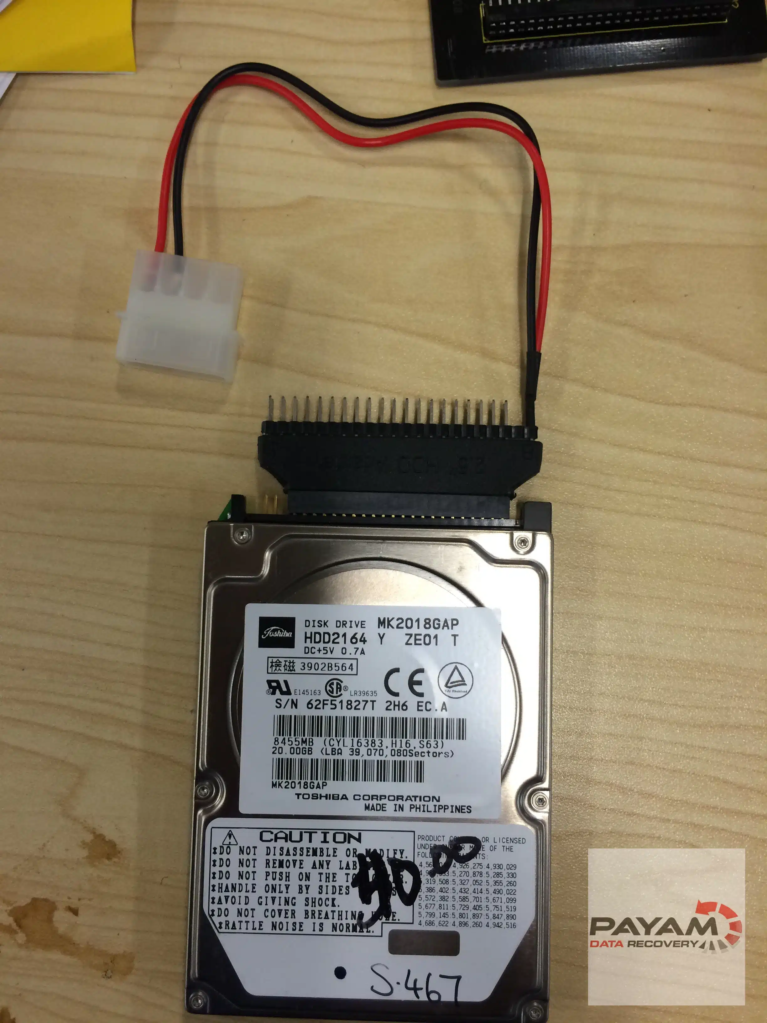 Payam Data Recovery technician handling 2.5 inch IDE drive for hard drive data recovery in Sydney