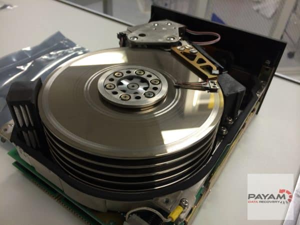 Payam Data Recovery technician repairing damaged hard drive in Sydney lab for expert data recovery.