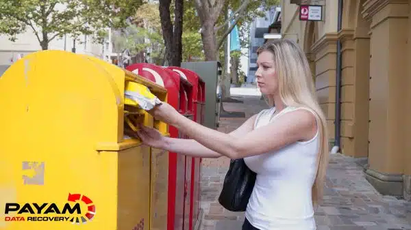 Payam Data Recovery staff mailing a customer parcel in Brisbane.