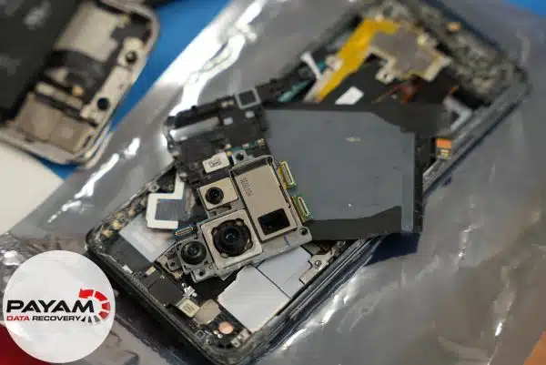 Galaxy S20 salt water case study showing logic board inspection before chip transplant