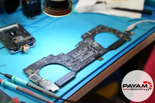 2019 MacBook Pro T2 firmware corruption case study showing capacitor repair and T2 revival