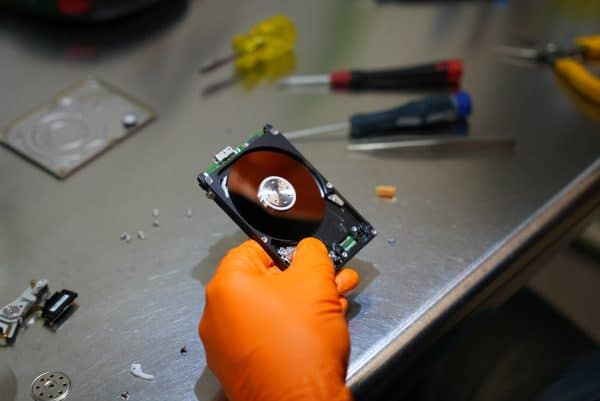 Recovering data from clicking hard drive in cleanroom at Payam Data Recovery Sydney