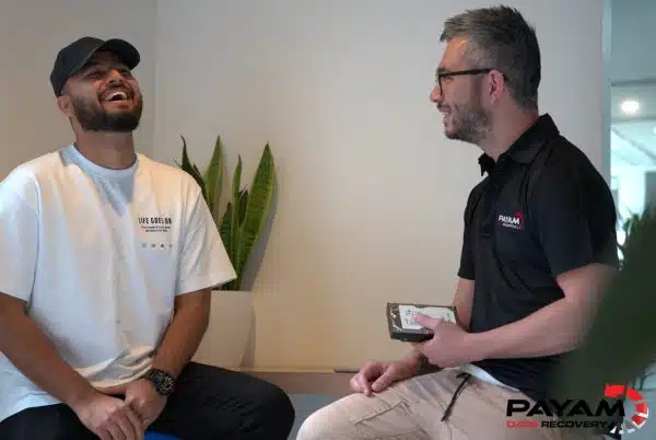 Two Payam Data Recovery technicians in Sydney discussing LaCie hard drive data recovery techniques.