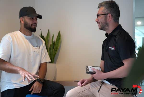 Two Payam Data Recovery employees discussing a data recovery case in Sydney.