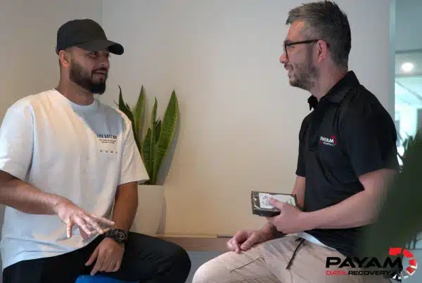 Two Payam Data Recovery employees discussing a data recovery case in Sydney for WD Elements USB hard drive data recovery.