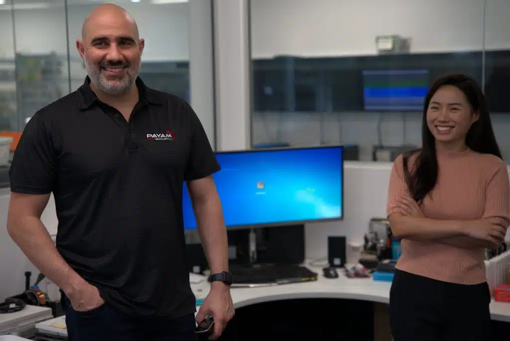 Payam Toloo and Holly from Payam Data Recovery smiling in the office