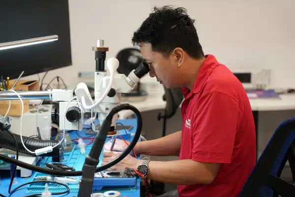 Payam Data Recovery Brisbane technician working on PCB transfer for clicking hard drive recovery