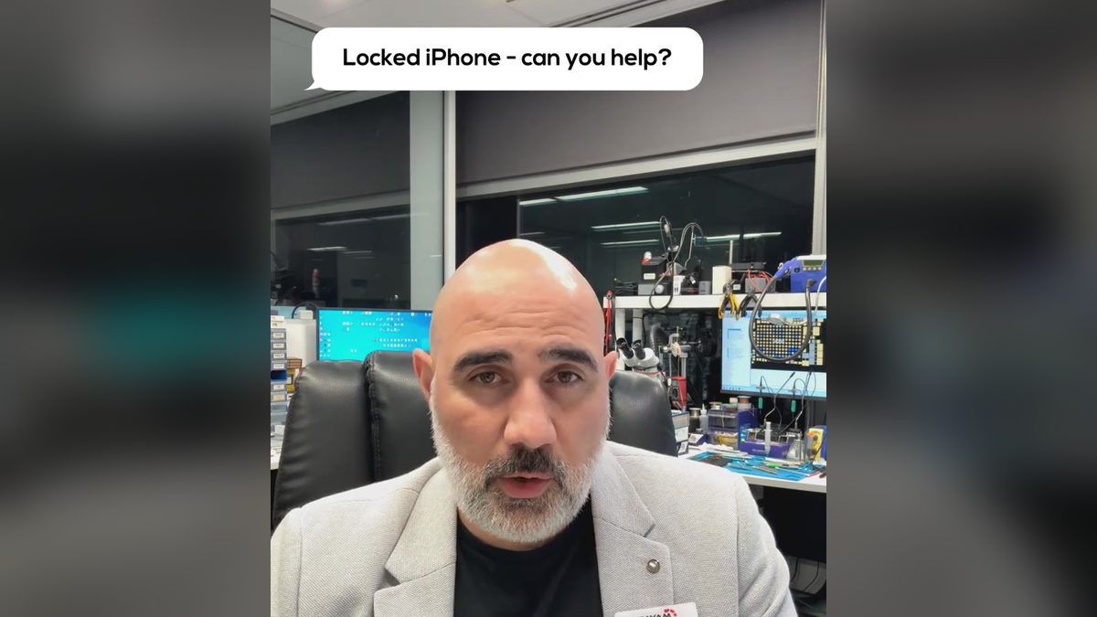 Video still: presenter in the lab with an on screen question about a locked iPhone