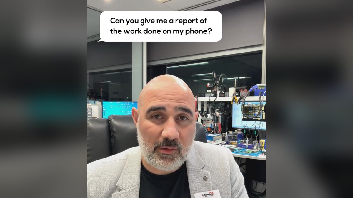 Video still: presenter in the lab with an on screen question about a report of the work done on a phone