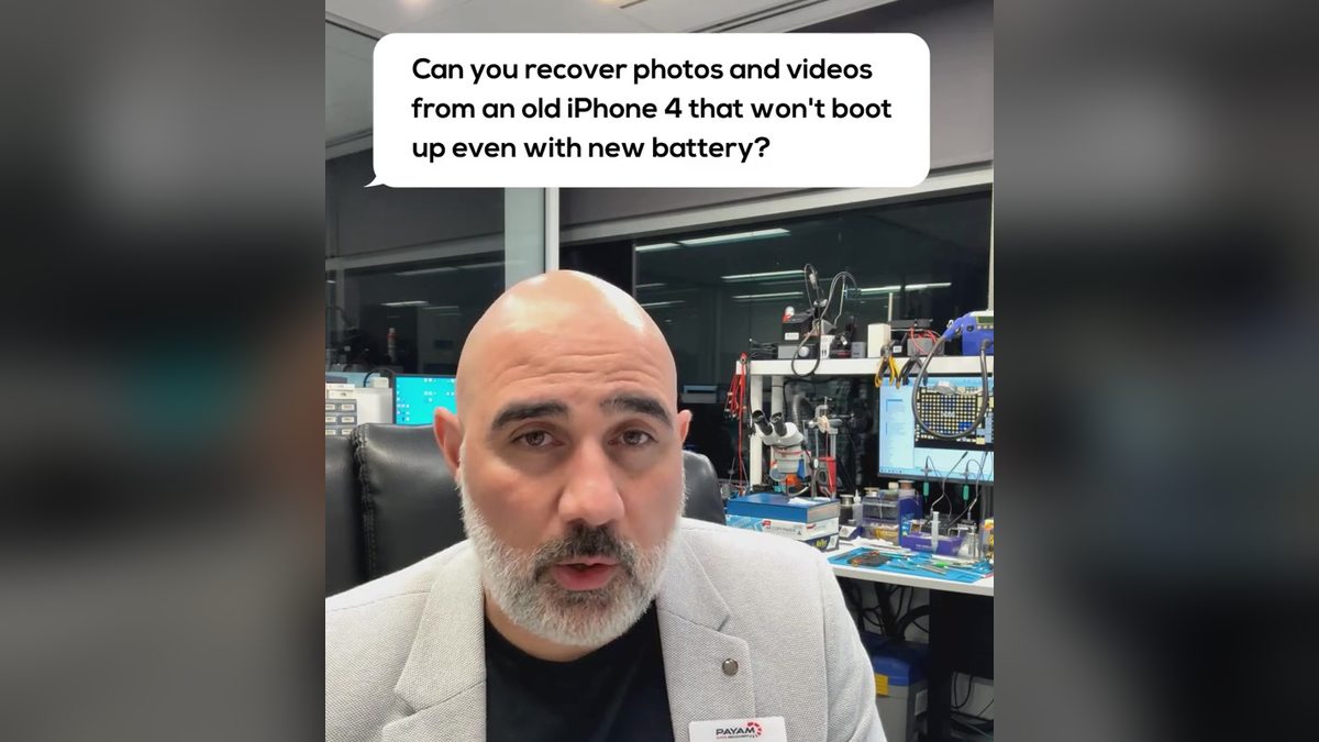 Video still: presenter in the lab with an on screen question about an old iPhone 4 that will not boot